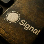 Close-up of a textured surface featuring the Signal logo.