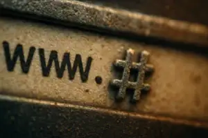 Close-up of a textured surface featuring "www." and a hashtag symbol.