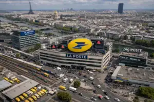 Aerial view of La Poste building in Paris with Eiffel Tower in the background.