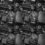 Close-up of a circuit board showing a blown e-fuse and smoke.